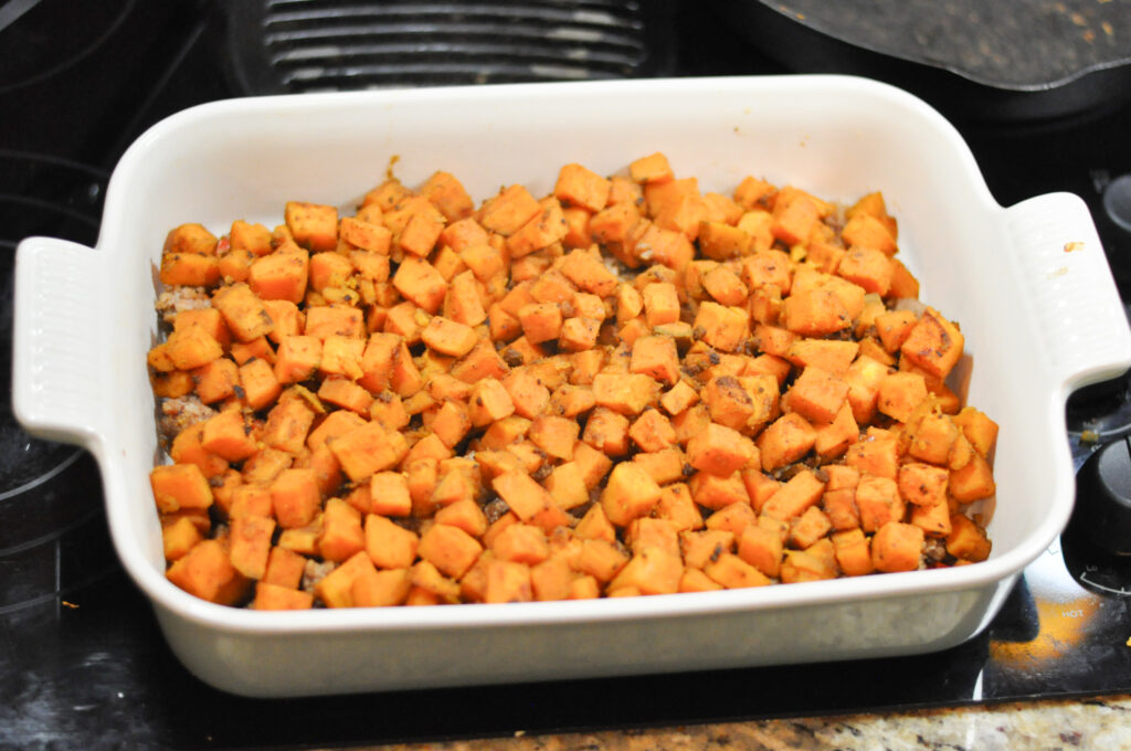 image of casserole dish with cooked diced sweet potatoes in it