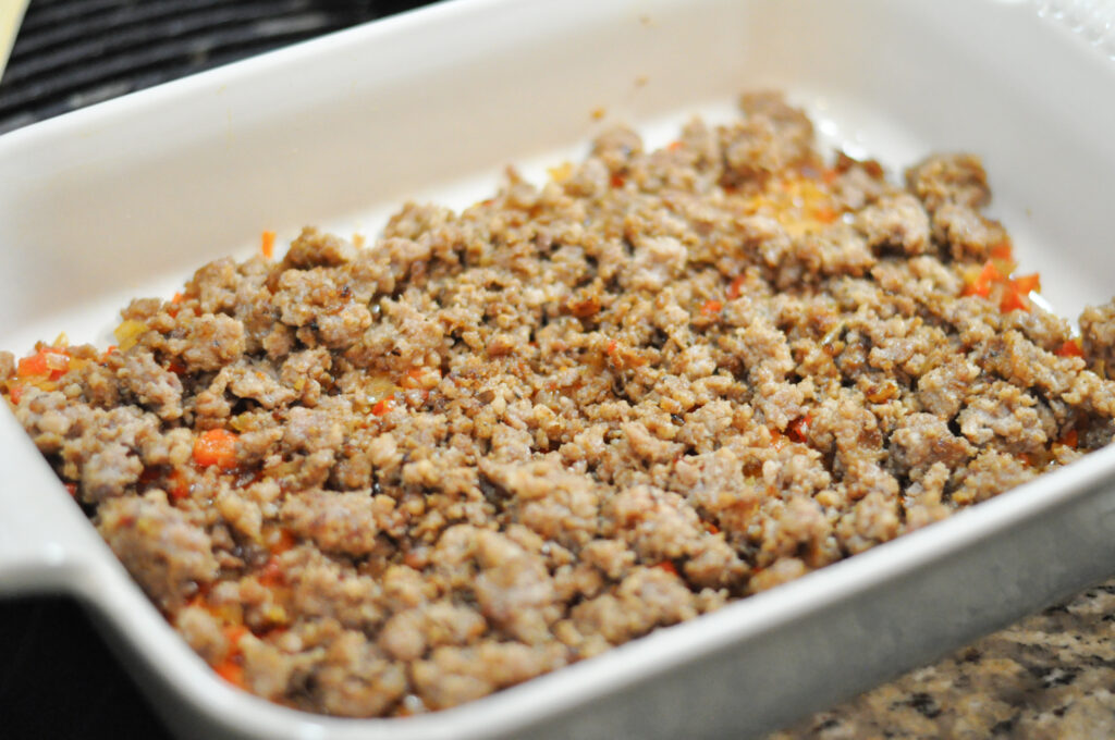up close image of casserole dish with cooked sausage in it